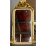 A large painted and gilt bevelled mirror, W. 85cm, H. 161cm.