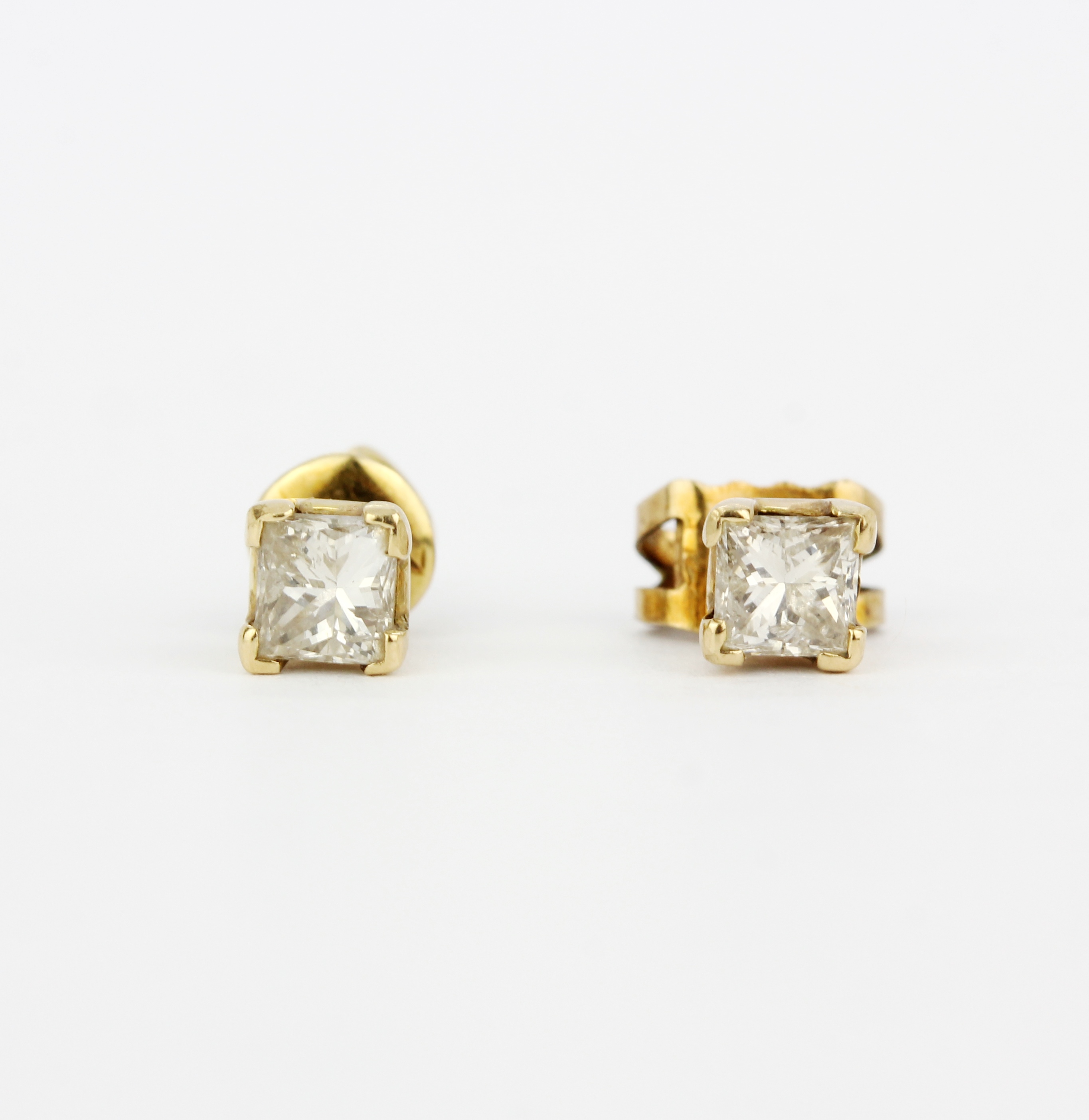 A pair of 18ct yellow gold stud earrings set with princess cut diamonds, L. 4mm. Backs not - Image 2 of 3