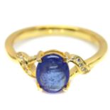A gold on 925 silver ring set with an oval cut sapphire, (O).