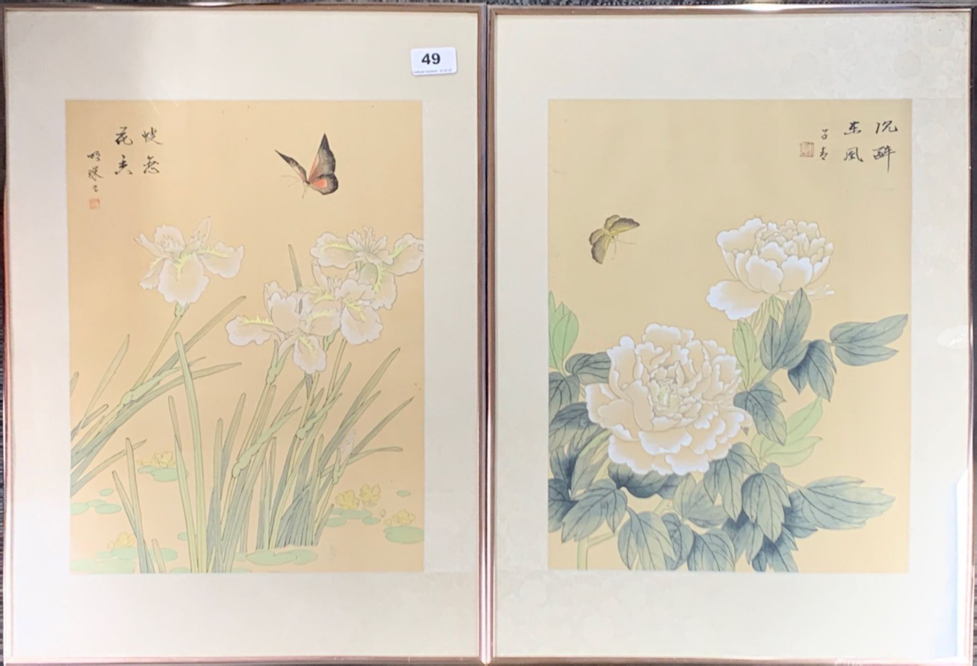 A pair of Chinese framed watercolours on silk of flowers with butterflies, frame 41 x 56cm.