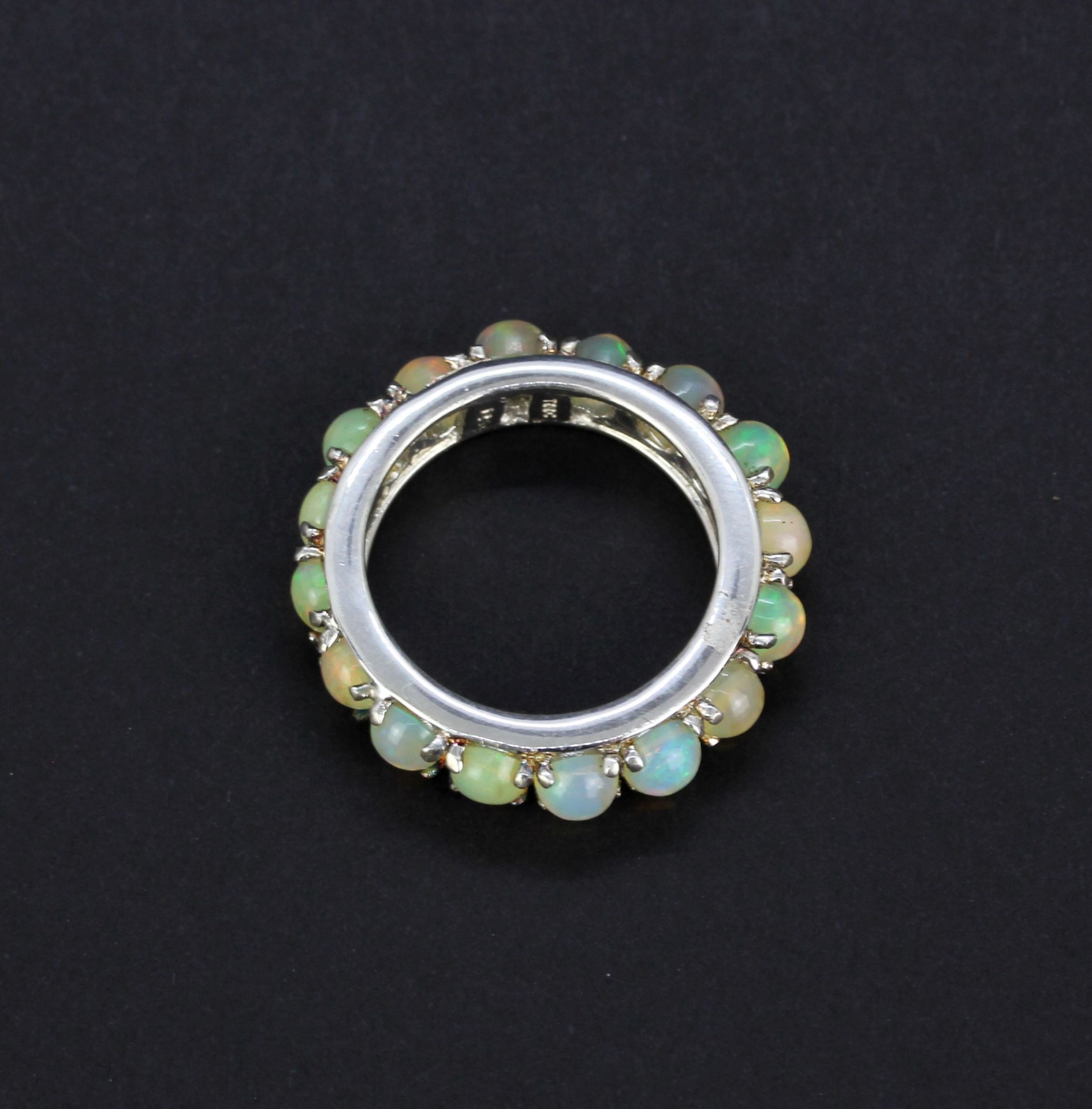 A 925 silver eternity ring set with round cabochon opals, approx. 2.97ct total, (N). With - Image 2 of 3