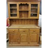 A pine kitchen dresser, W. 137cm, H. 200cm.
