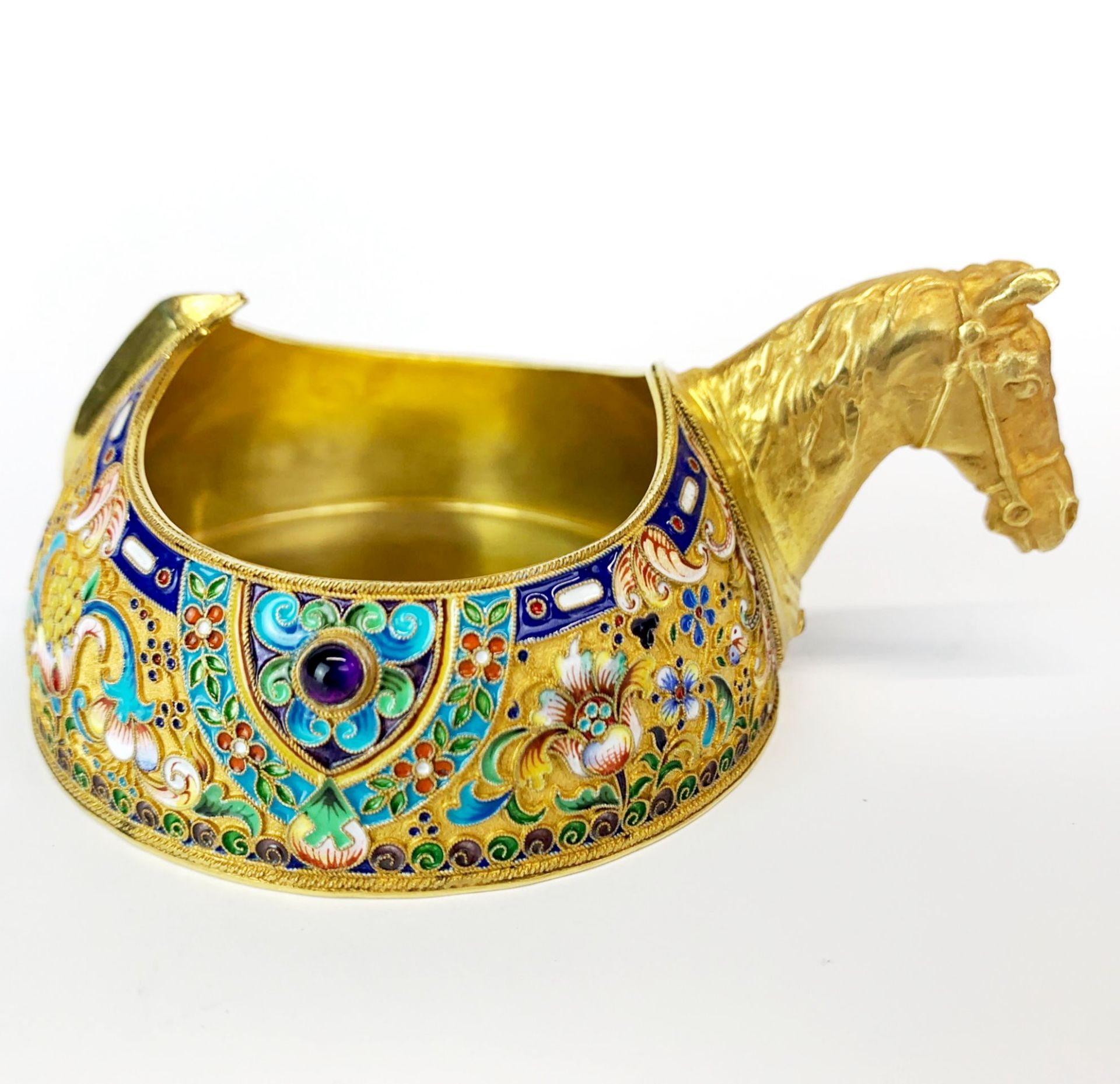 A superb Russian silver gilt and enamelled horses head kvosch inset with cabochon amethyst, Dia.