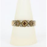 A hallmarked 9ct yellow gold champagne and white diamond set ring, (R.5).