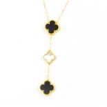 An 18ct yellow gold onyx and mother of pearl clover necklace, L. 45cm.