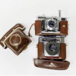 A Voightlander synchro-compur camera. Together with a further vintage camera.