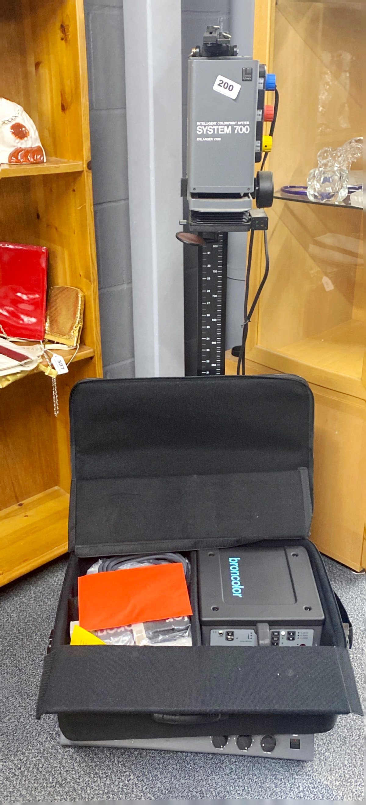 A Fujimoto system 700 colour photographic enlarger. Together with a cased broncolor lighting
