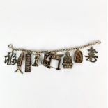 A silver charm bracelet set with vintage Chinese white metal (silver) charms.