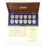 A cased set of The Royal Arms silver ingots.