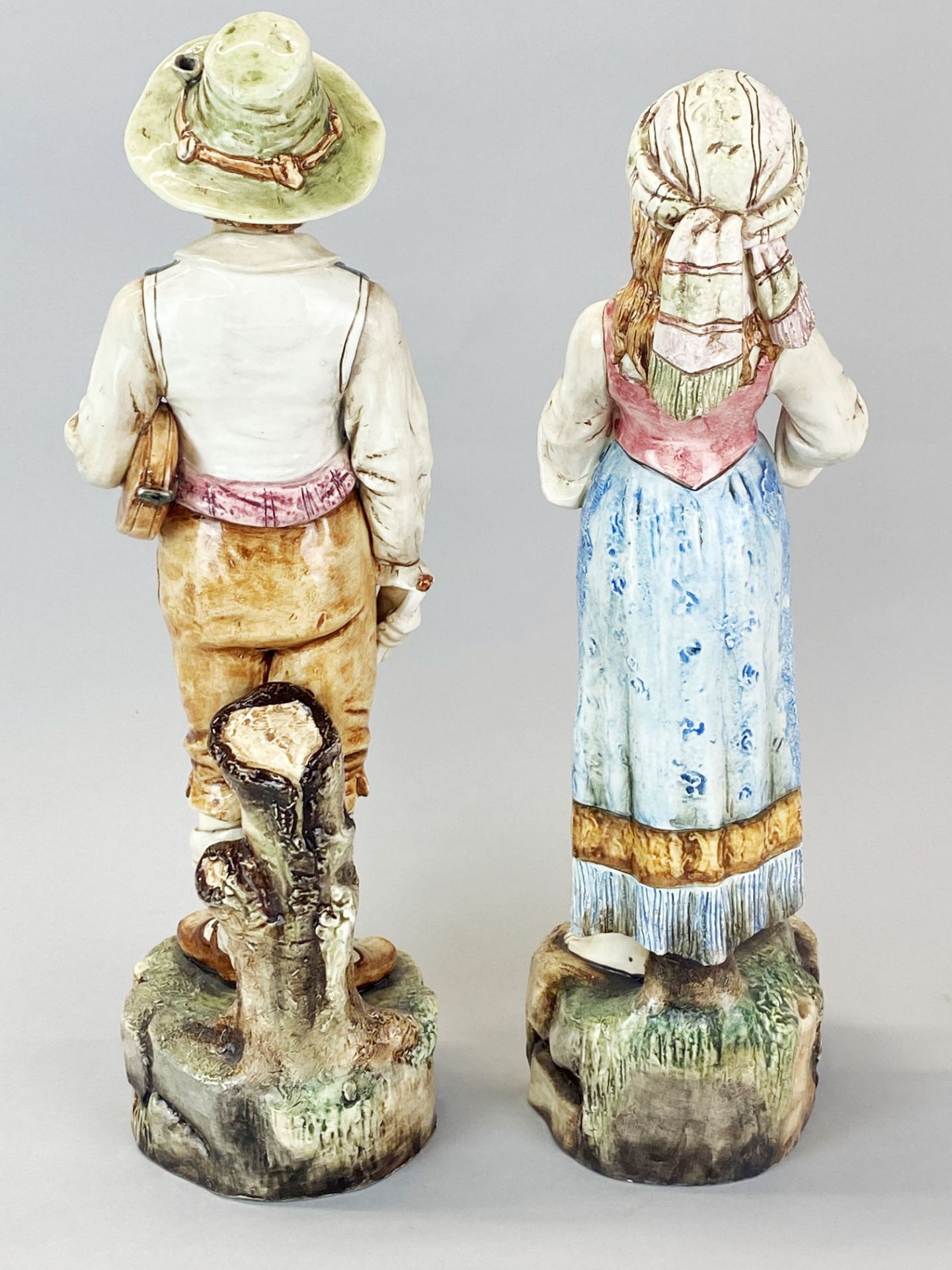 A pair of Austrian glazed pottery figures of musicians c.1900, H. 40cm. Girl A/F to top of lute. - Image 2 of 3