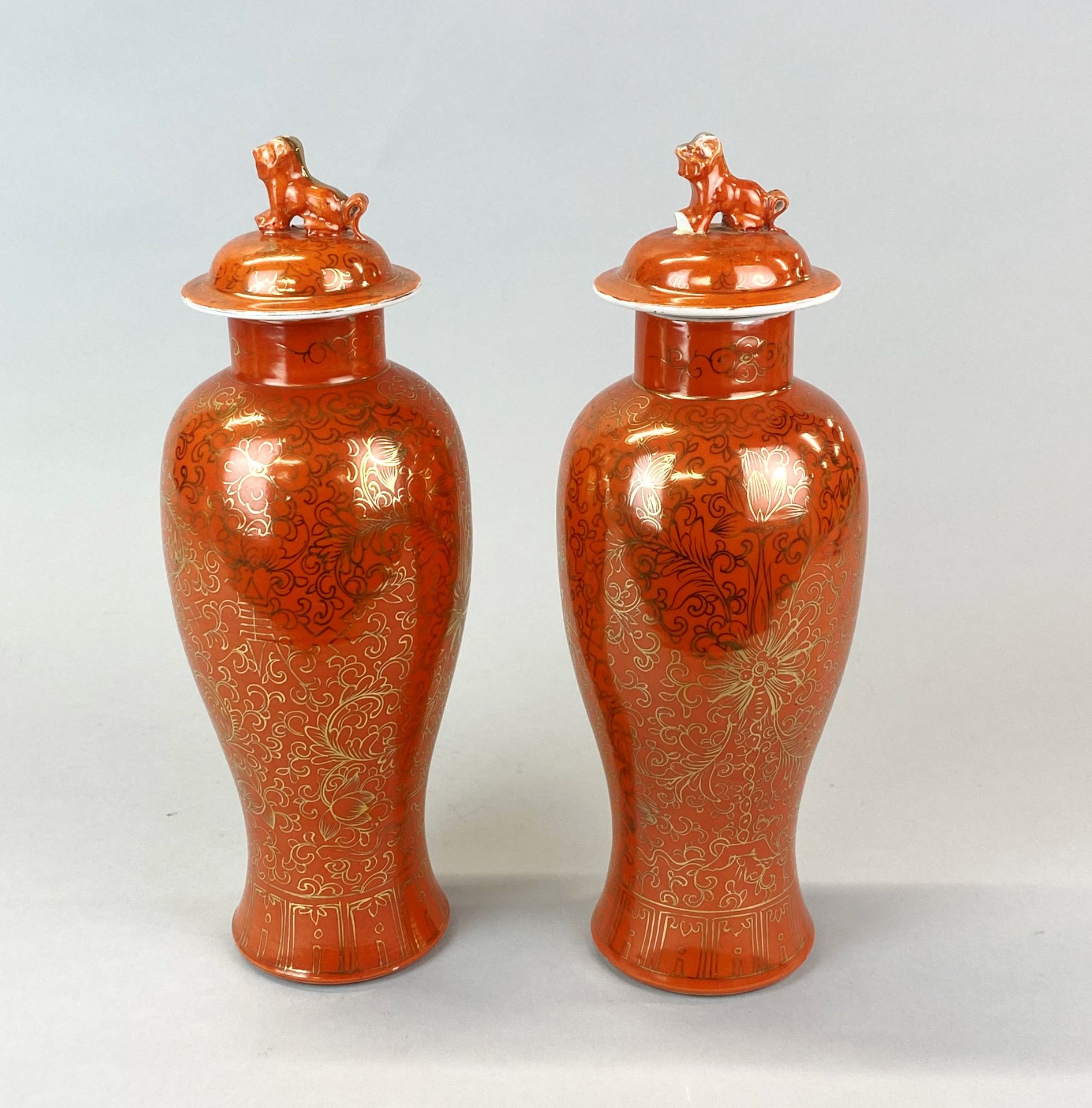 A pair of mid 20th Century Chinese orange glazed and gilt porcelain jars and lids, H. 31cm. One