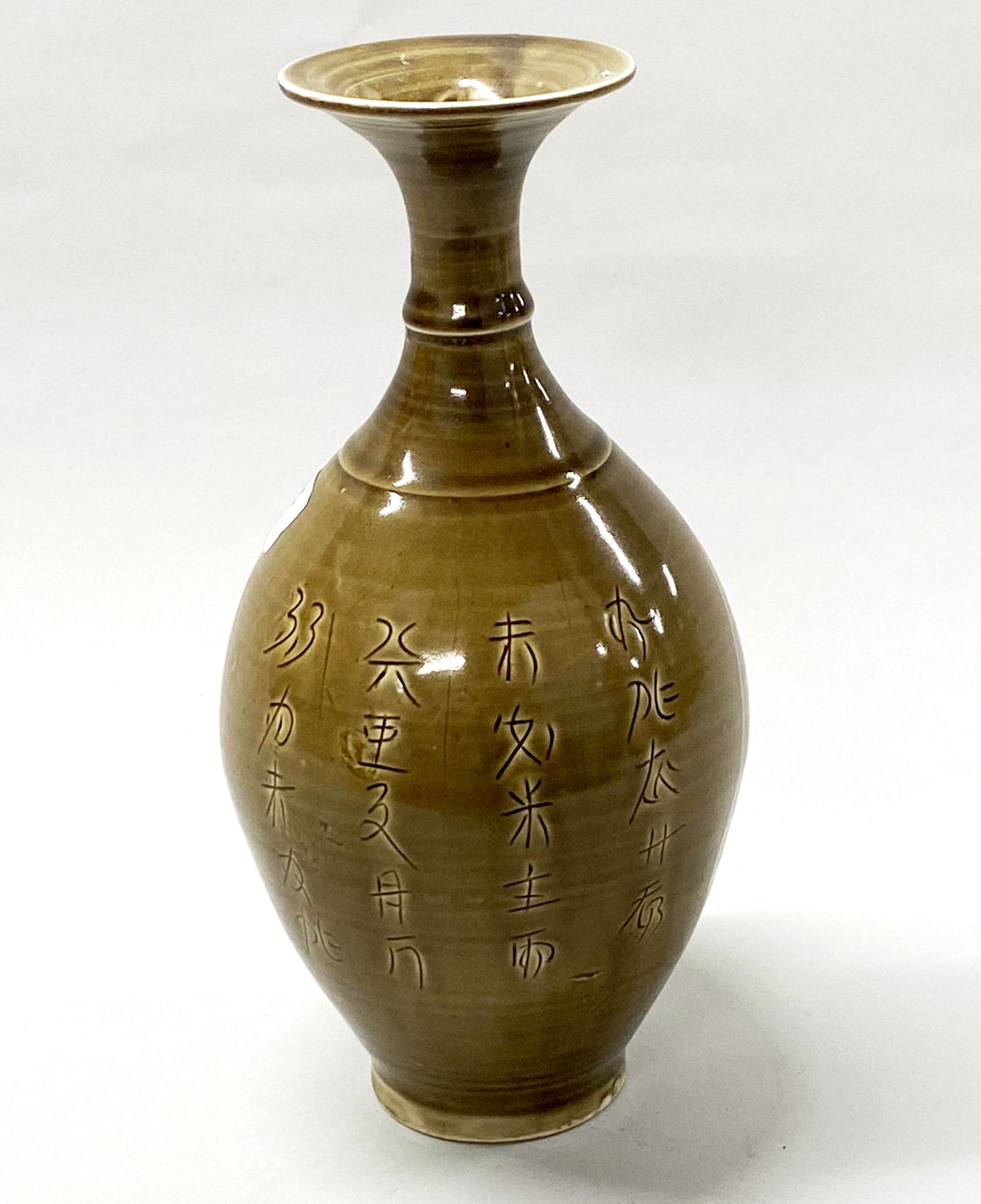 A Chinese Ming Dynasty style incised and olive green glazed porcelain vase, H. 27cm. - Image 3 of 4