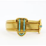 A heavy high carat gold (tested approx. 22ct gold) and turquoise buckle bangle/bracelet, widest