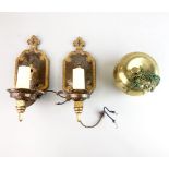 A pair of Arts & Crafts cast and hammered brass wall lights, H. 28cm. Together with a brass apple