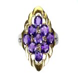 A gold on 925 silver ring set with oval cut amethysts, (N).