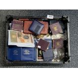 A tray of mixed collectible coins.