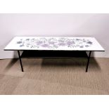 A John Piper style formica topped, two tier coffee table, 115 x 38 x 36cm.