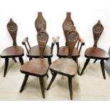 A set of six signed 'Jack Grimble' of Cromer carved oak dining chairs decorated with a tudor rose to