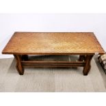 A heavy quality carved oak coffee table, 120 x 54 x 47cm.