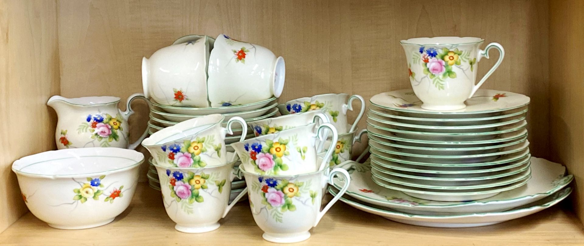 An extensive 1930's hand painted Noritake porcelain tea set, twelve settings.