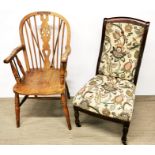 A 20th Century spindle back oak hall chair together with a mahogany chair on castors with floral