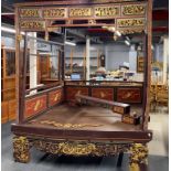 A 19thC Chinese carved, painted and gilt marriage bed 216 x 150 x 250cms. In generally good