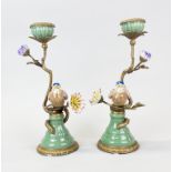 A pair of porcelain and gilt brass candlesticks, H. 30cm.