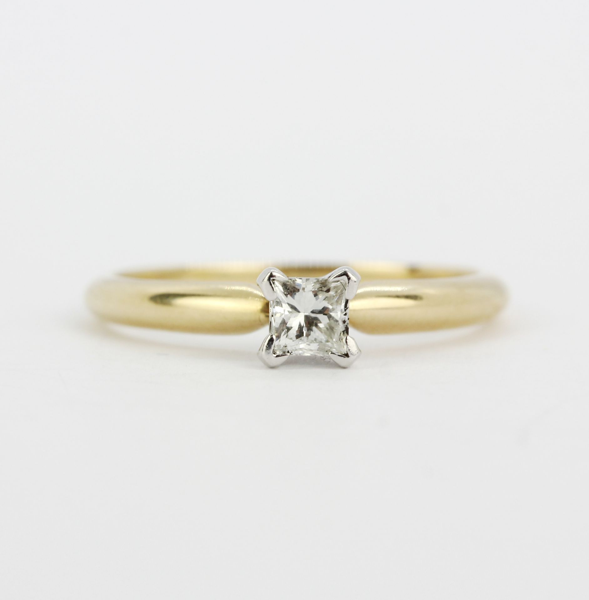 A 14ct yellow gold solitaire ring set with a princess cut diamond, (M.5). - Image 2 of 3