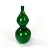 A Chinese apple green glazed porcelain gourd vase, H. 17cm.