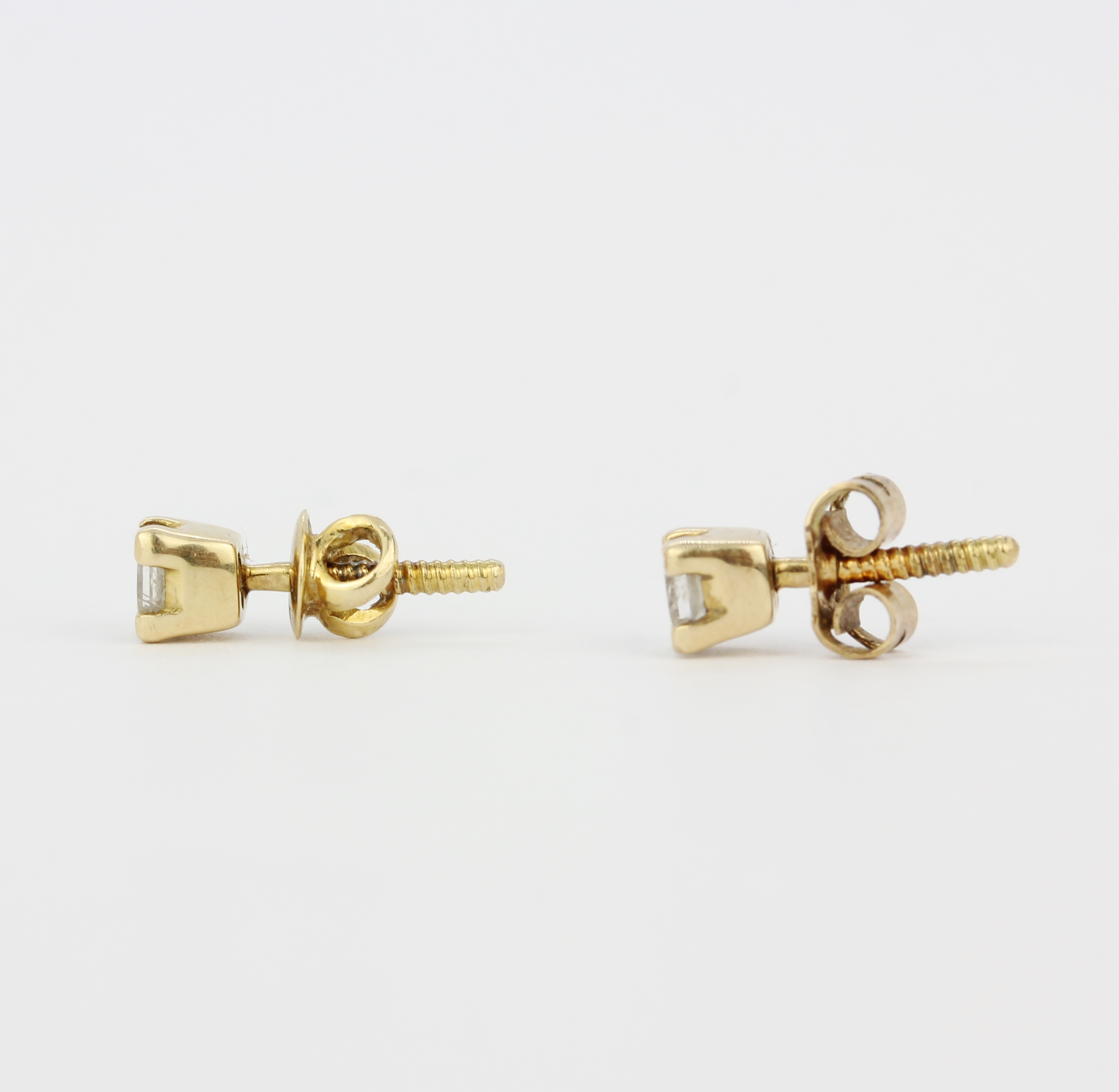 A pair of 18ct yellow gold stud earrings set with princess cut diamonds, L. 4mm. Backs not - Image 3 of 3