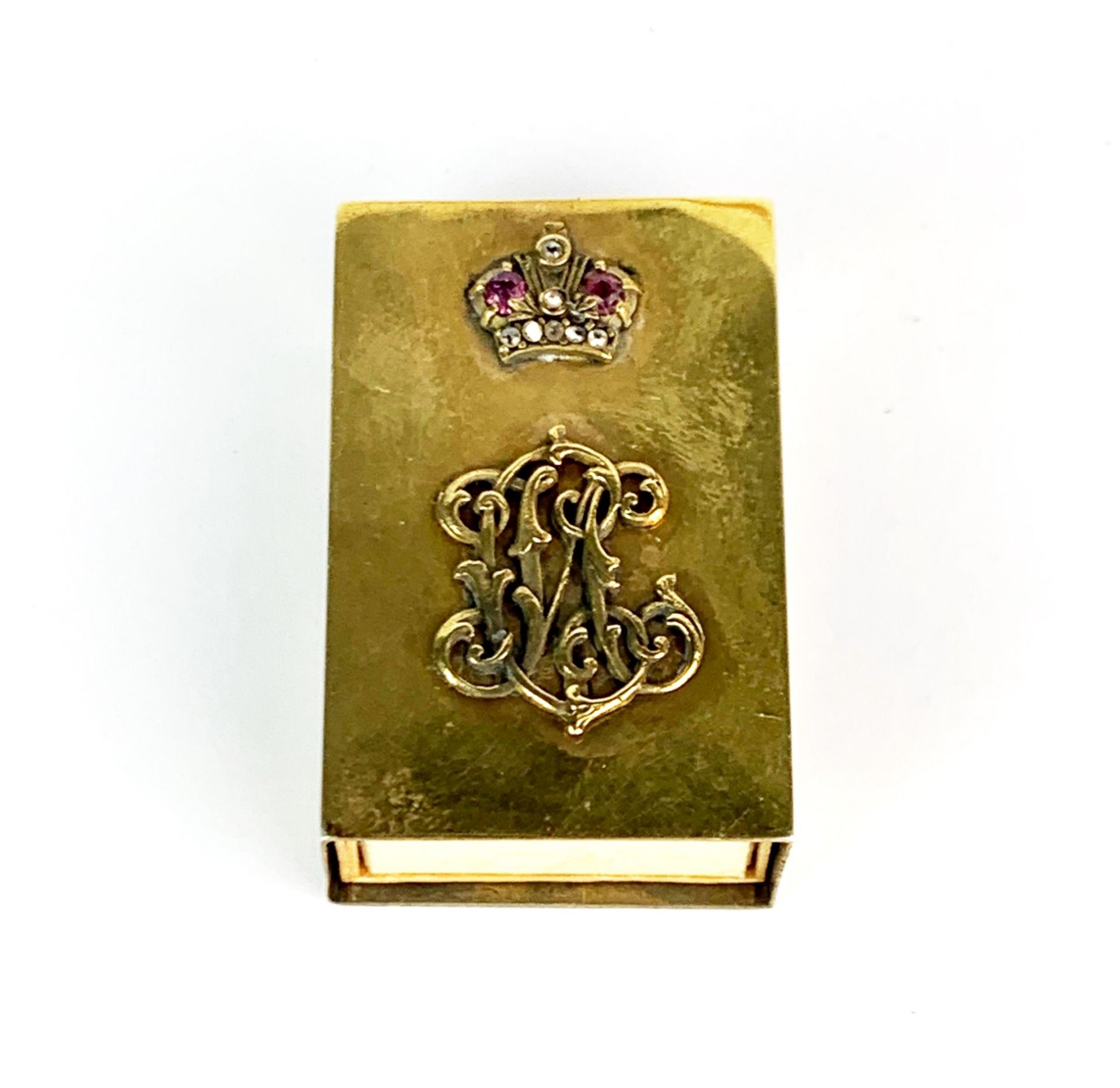 A Russian silver gilt and enamel matchbox cover set with rubies and diamonds, 4.1 x 2.8 x 1.5cm.