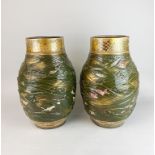 A superb pair of 19th century glazed and gilt Satsuma pottery vases featuring relief decoration of