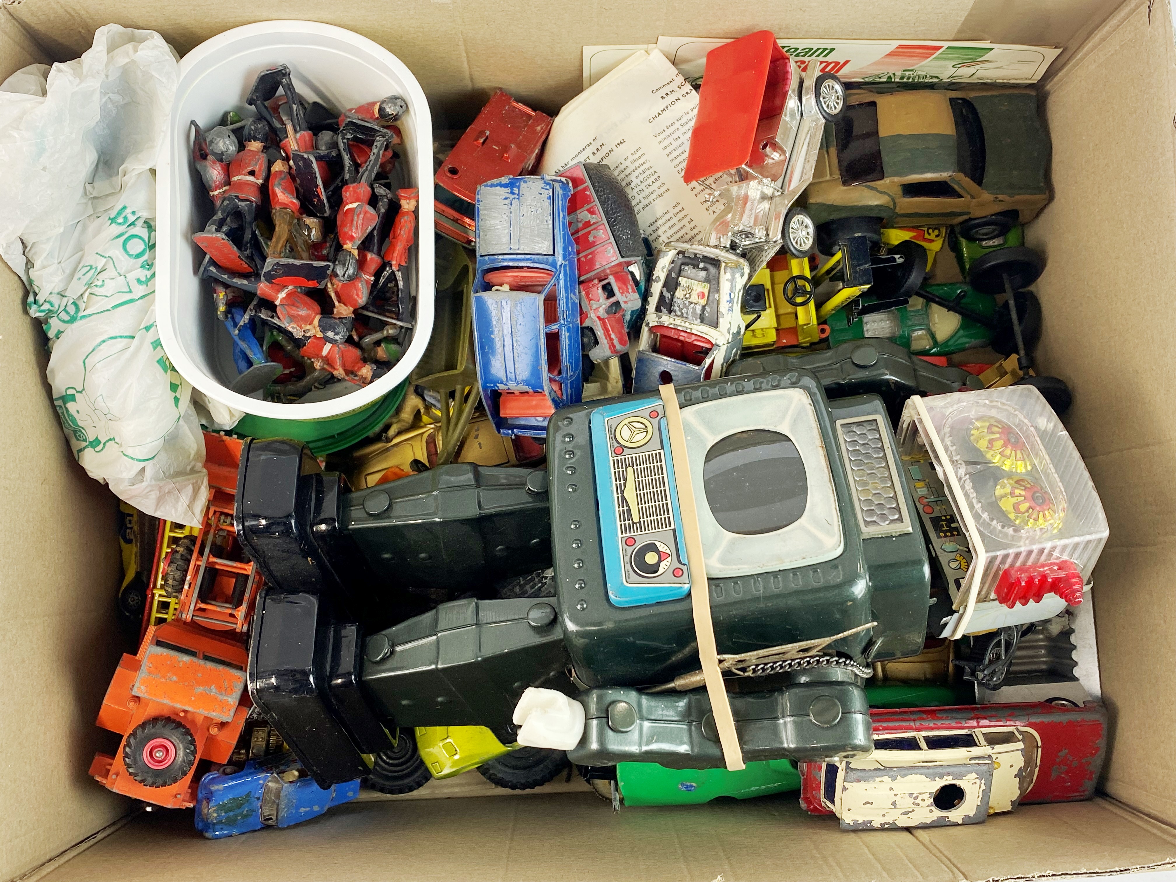 A battery operated tin plate toy robot with a quantity of die cast models, lead soldiers etc.