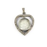 A white metal 'crazy diamond' Diamond set heart pendant, L. 3cm.