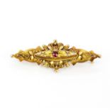 An antique 9ct gold brooch set with a tourmaline and diamonds, L. 4.5cm. Pin slightly loose.