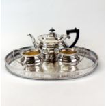 A Garrard and Co silver plated tea set and gallery tray.