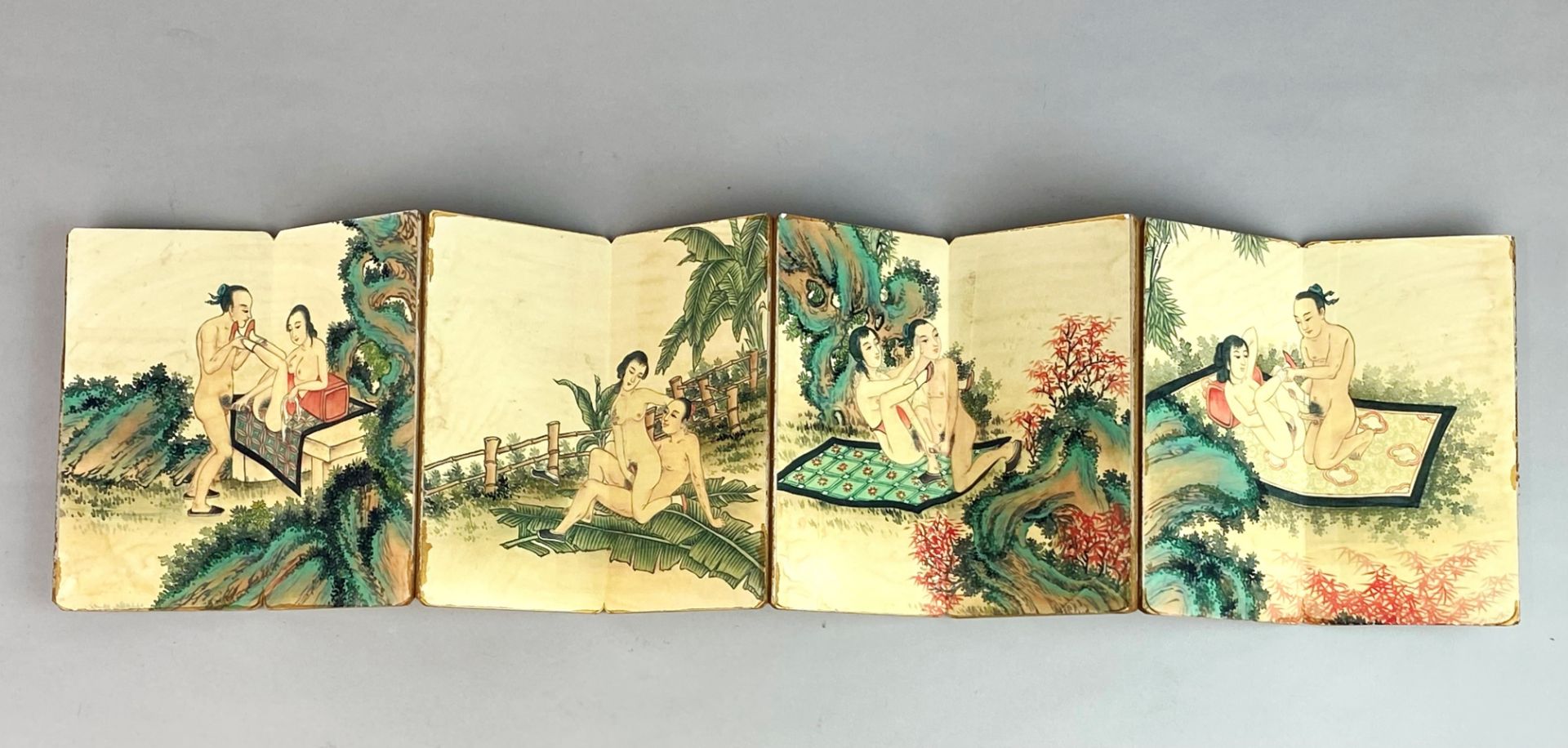 Two folding books of Chinese erotic pictures, largest size 18 x 12cm. Panels of larger book