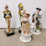 A pair of porcelain figurines, with a pair of resin soldier figures, tallest H. 34cm.