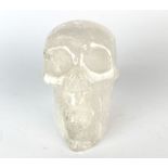 A carved rock crystal skull, H. 7cm.