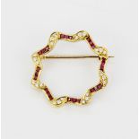 An 18ct yellow gold ruby and diamond brooch, L. 2.5cm.