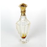 An antique cut glass perfume bottle with 18ct gold top, continental mark and tested, H. 10cm.