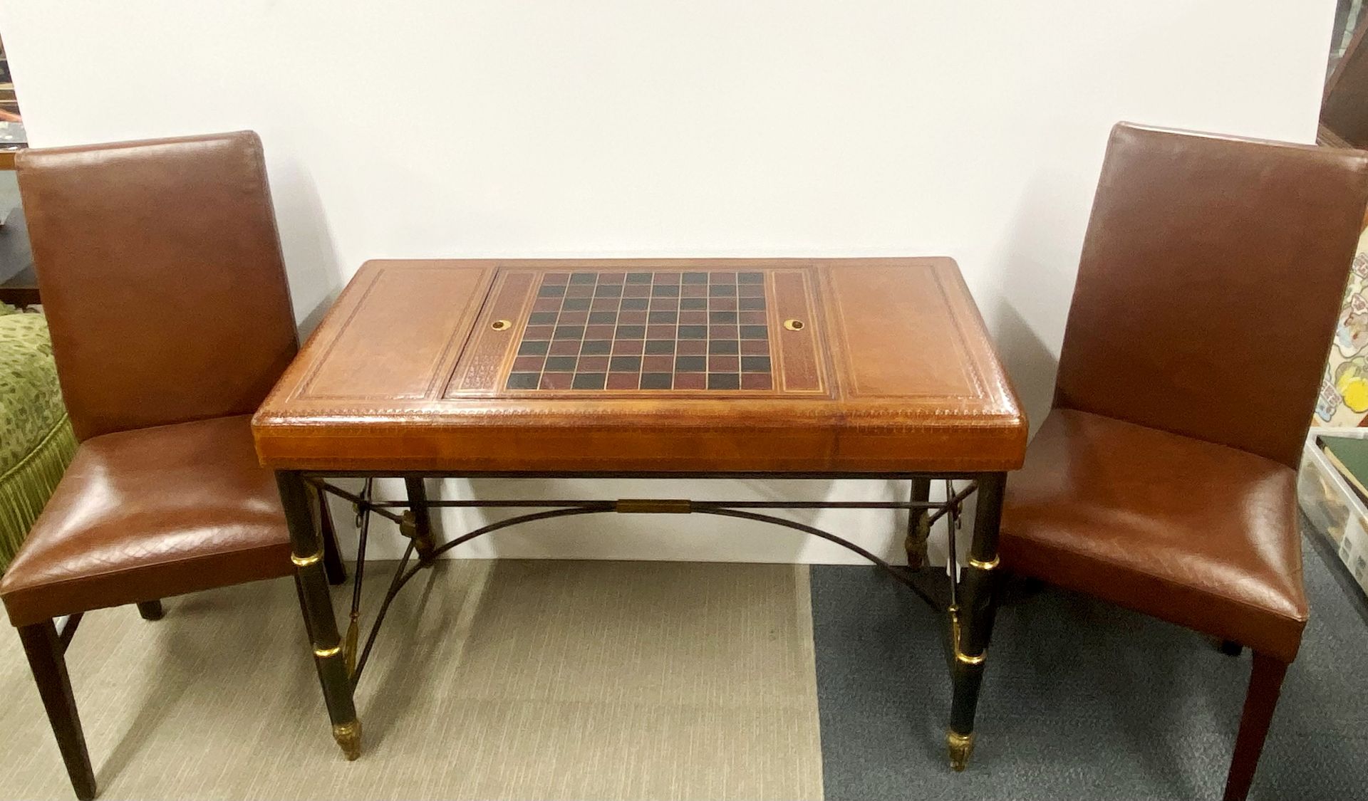 A lovely leather covered iron and brass framed chess and backgammon table, 111 x 73 x 55cm