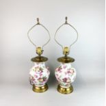 A pair of vintage porcelain and gilt brass table lamps, H. 65cm (with shade frame).