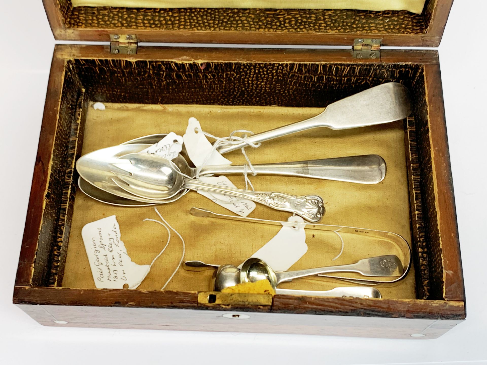 A Victorian box of mixed silver spoons etc.