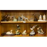 A collection of mixed animal and bird figures.