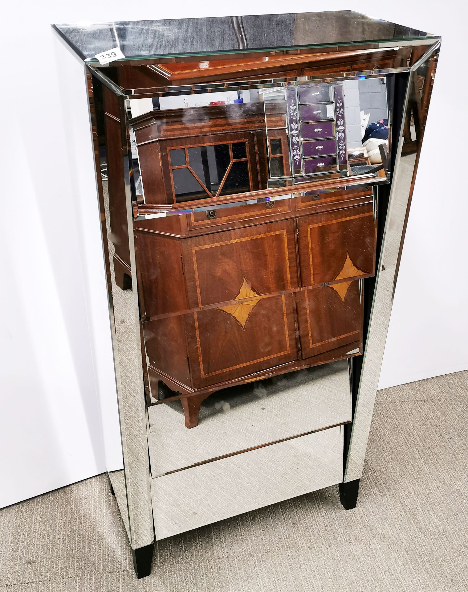 A contemporary mirror finished five drawer chest, 61 x 31 x 121cm. Minor chip to corner.