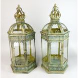 A pair of metal and glass garden lanterns, H. 62cm.