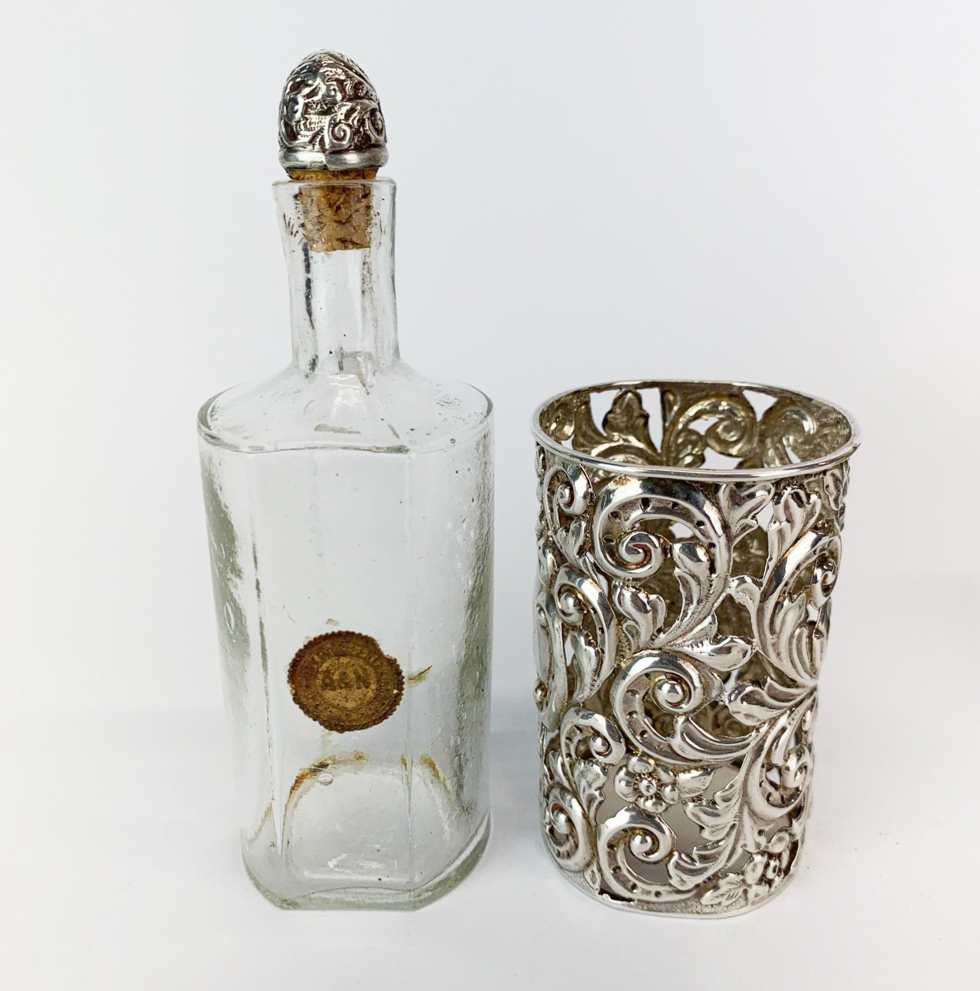 A hallmarked silver cased cologne bottle (Chester c.1908) H. 14cm together with a white metal topped - Image 4 of 5