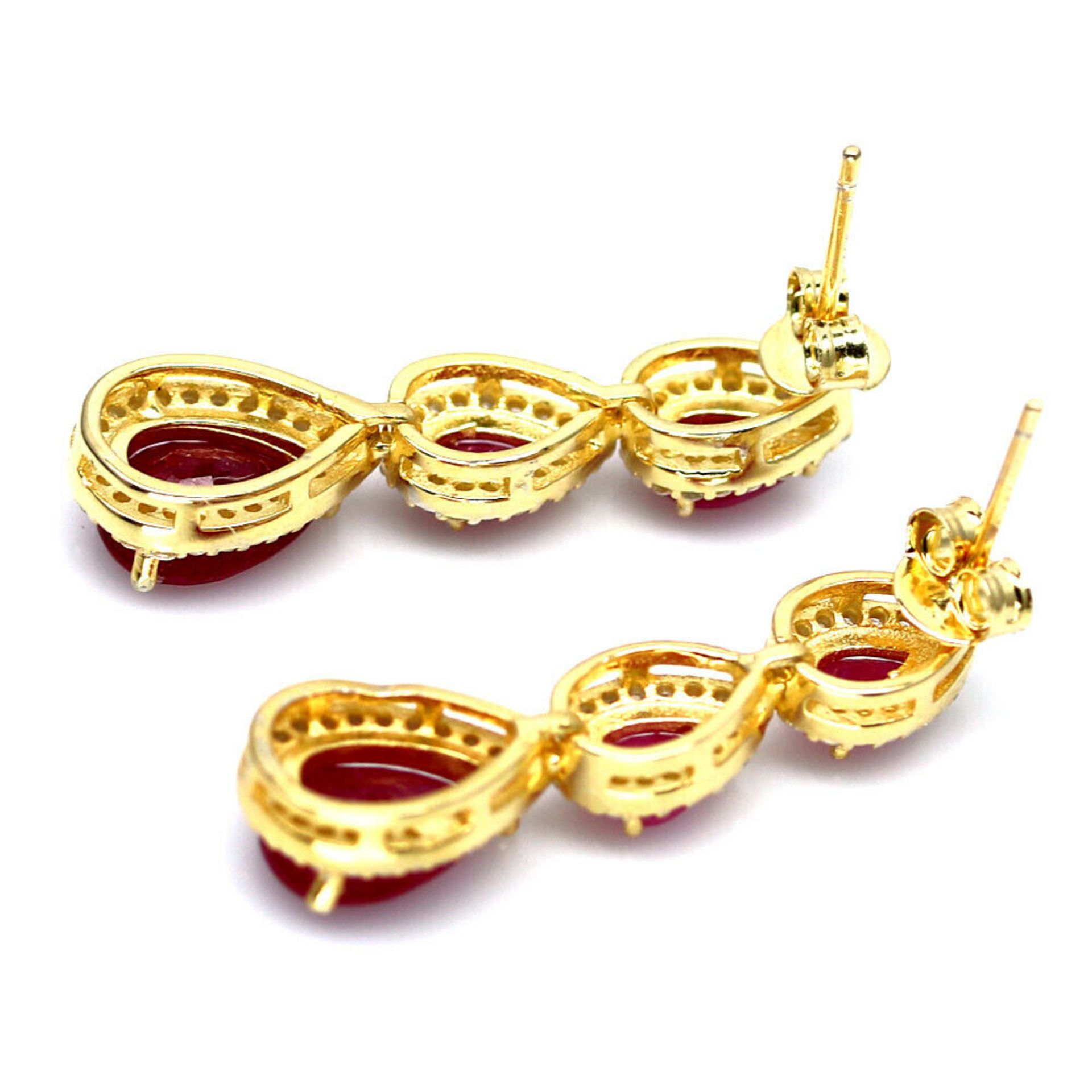 A pair of 925 silver gilt drop earrings set with pear cut rubies and white stones, L. 3cm. - Image 2 of 2