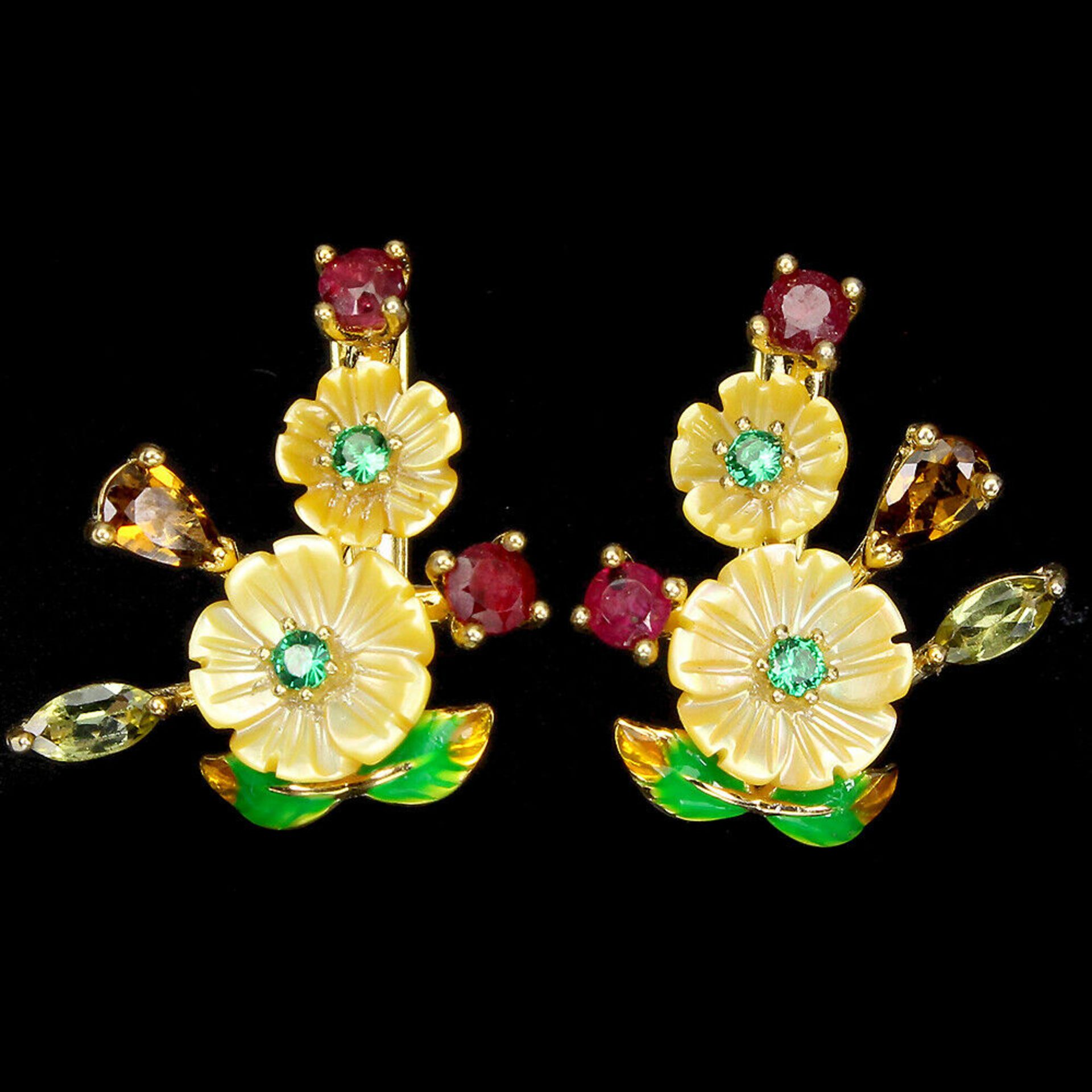 A pair of gold on 925 silver enamelled earrings set with carved mother of pearl, rubies and other